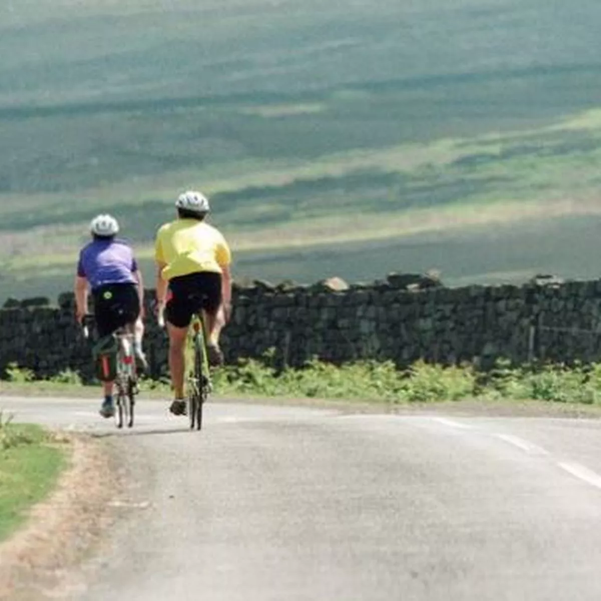 Illustration for the theory test question: How should you pass the cyclists?
