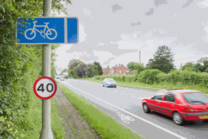 Illustration for the theory test question: There is a cycle lane in use, indicated by a solid white line. What does this represent for motorists?